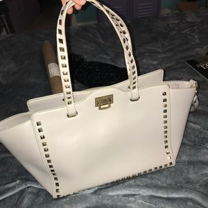 Lilac BCBG bag with gold pyramid stud accents